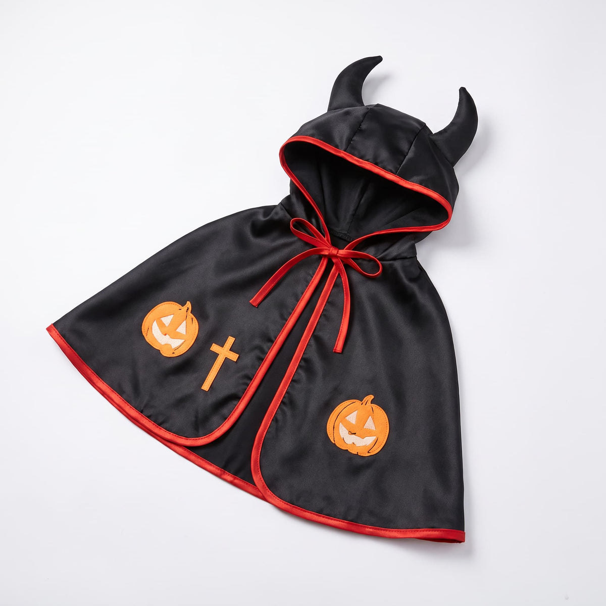 Black and red hooded devil dog Halloween cape with horns and pumpkin details on a white background
