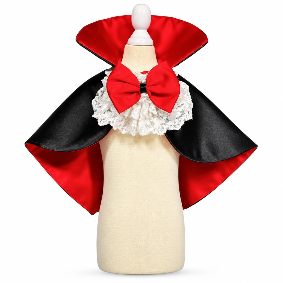 Black and red vampire pet cape with white ruffle collar and red bow displayed on a mannequin.
