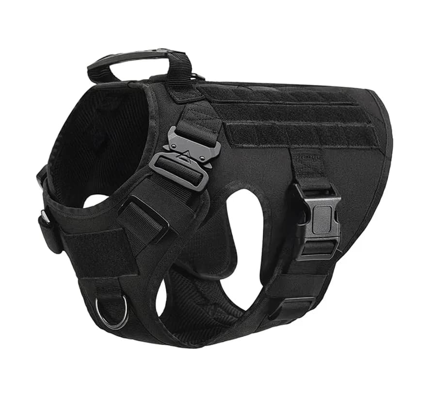 Black tactical dog harness with adjustable straps, secure buckles and a top handle on a white background.