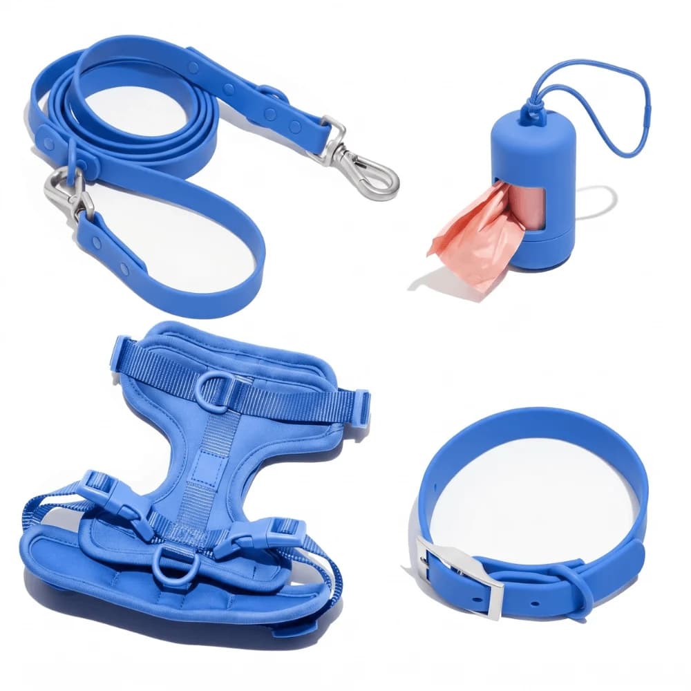 Bright blue dog harness with matching walking lead, adjustable collar and waste bag holder on a white background.