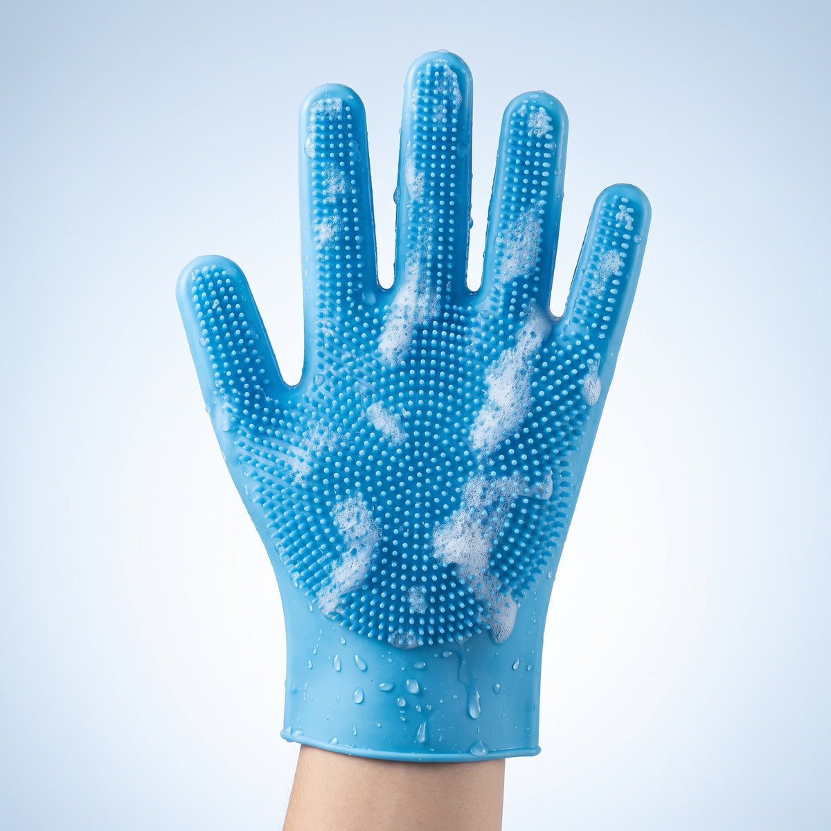 Blue silicone pet grooming glove with textured bristles for bathing and removing loose fur
