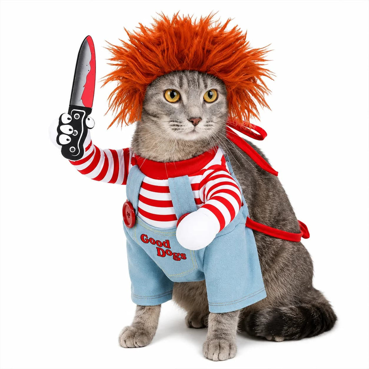 Grey cat wearing a red haired Chucky style pet costume with striped shirt and blue overalls.