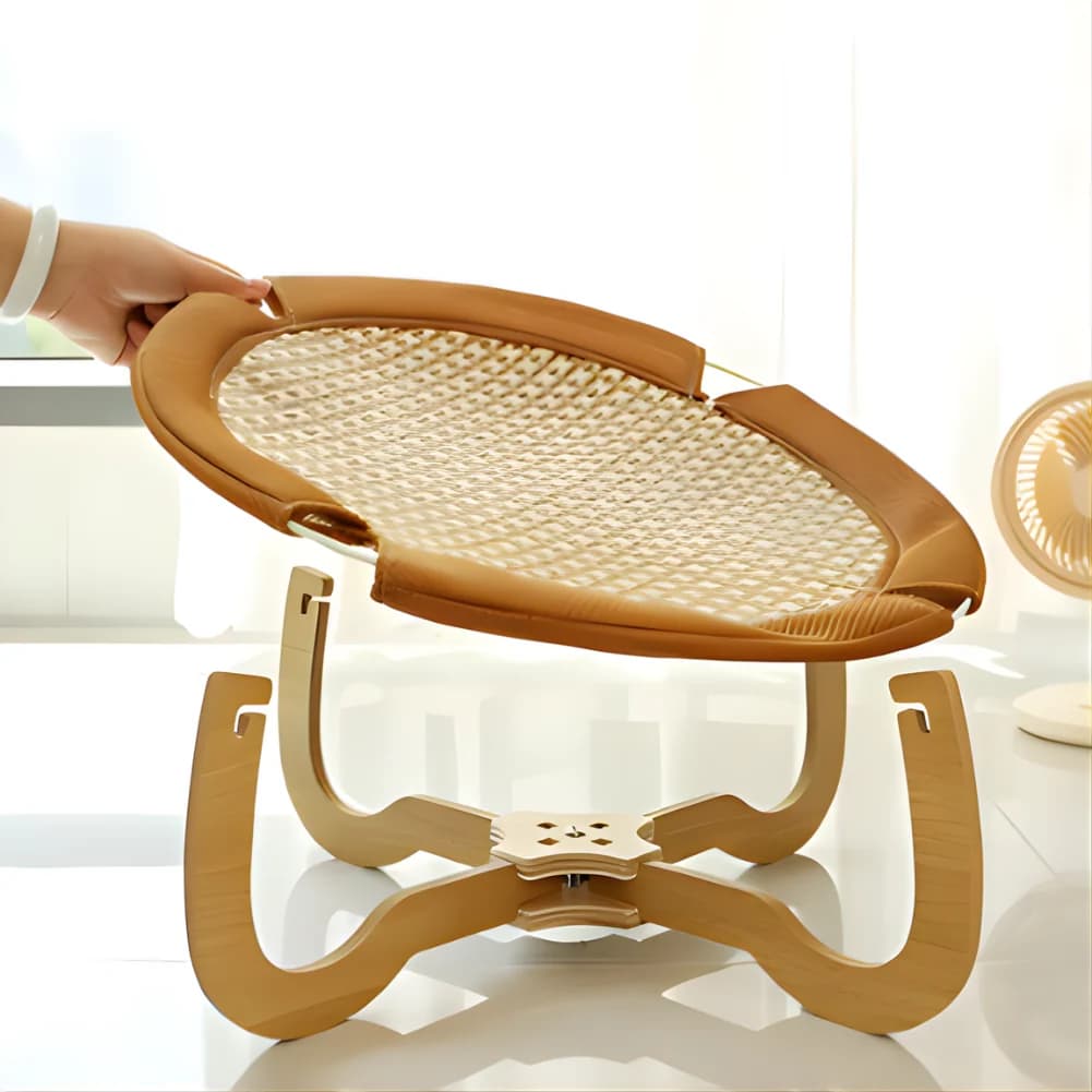 Natural woven elevated cat hanging bed with curved wooden support frame displayed on a clean white background