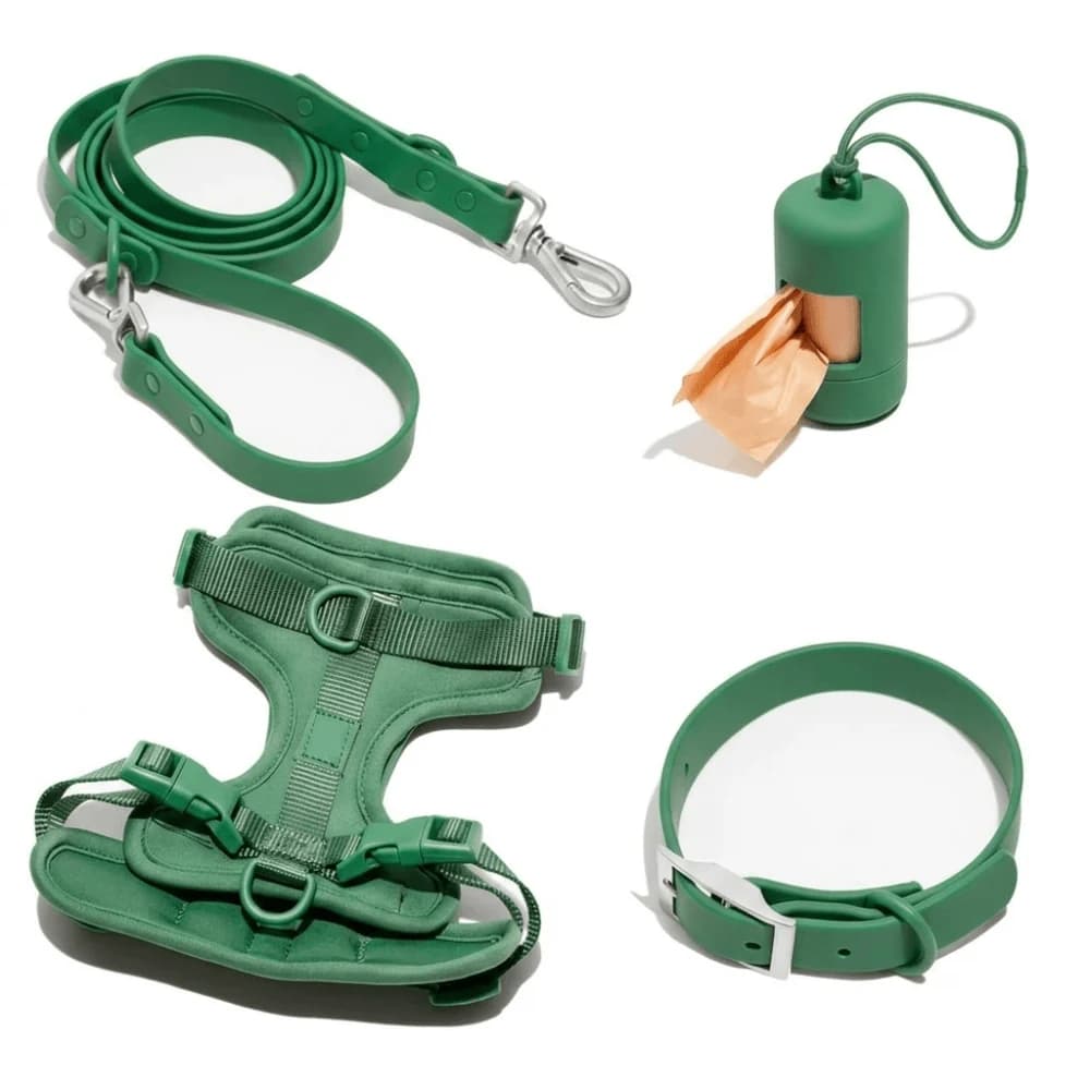 Green adjustable dog harness set with matching lead, collar and waste bag holder displayed on a white background.
