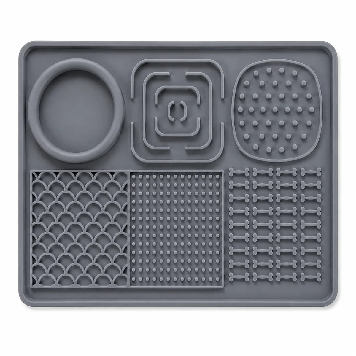 Grey rectangular dog slow feeder lick mat featuring raised textured patterns, feeding compartments and a built-in bowl.