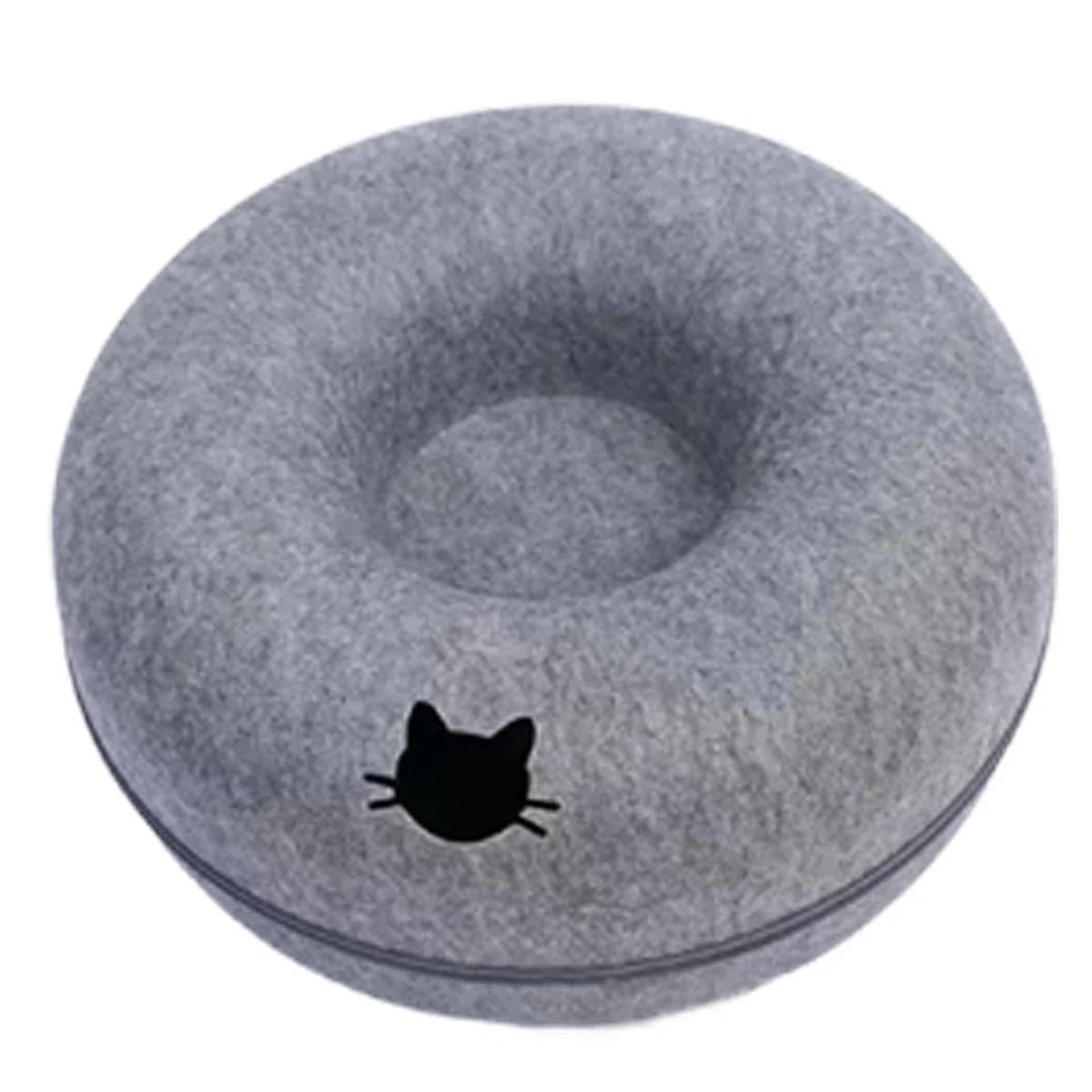 Overhead view of a grey plush donut cat bed with a soft circular sleeping area and cat-shaped opening