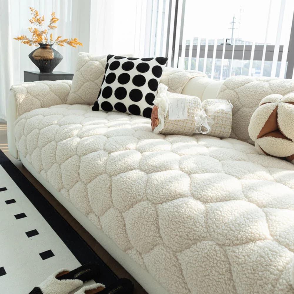 White quilted sherpa fleece sofa cover protecting a modern couch while creating a soft comfortable lounging surface